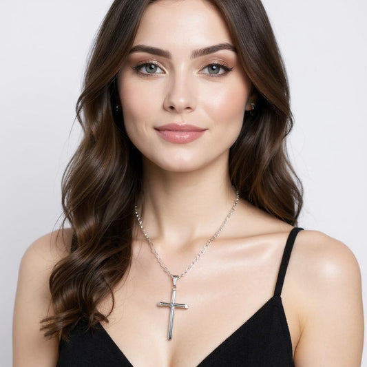 Woman wearing Elegant 14K White Gold Cross Pendant on a 4mm Figaro Chain – 22" Versatile Fashion Jewelry for Layering or Solo Wear